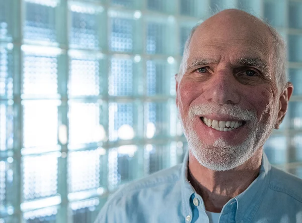Smiling older patient with a white beard